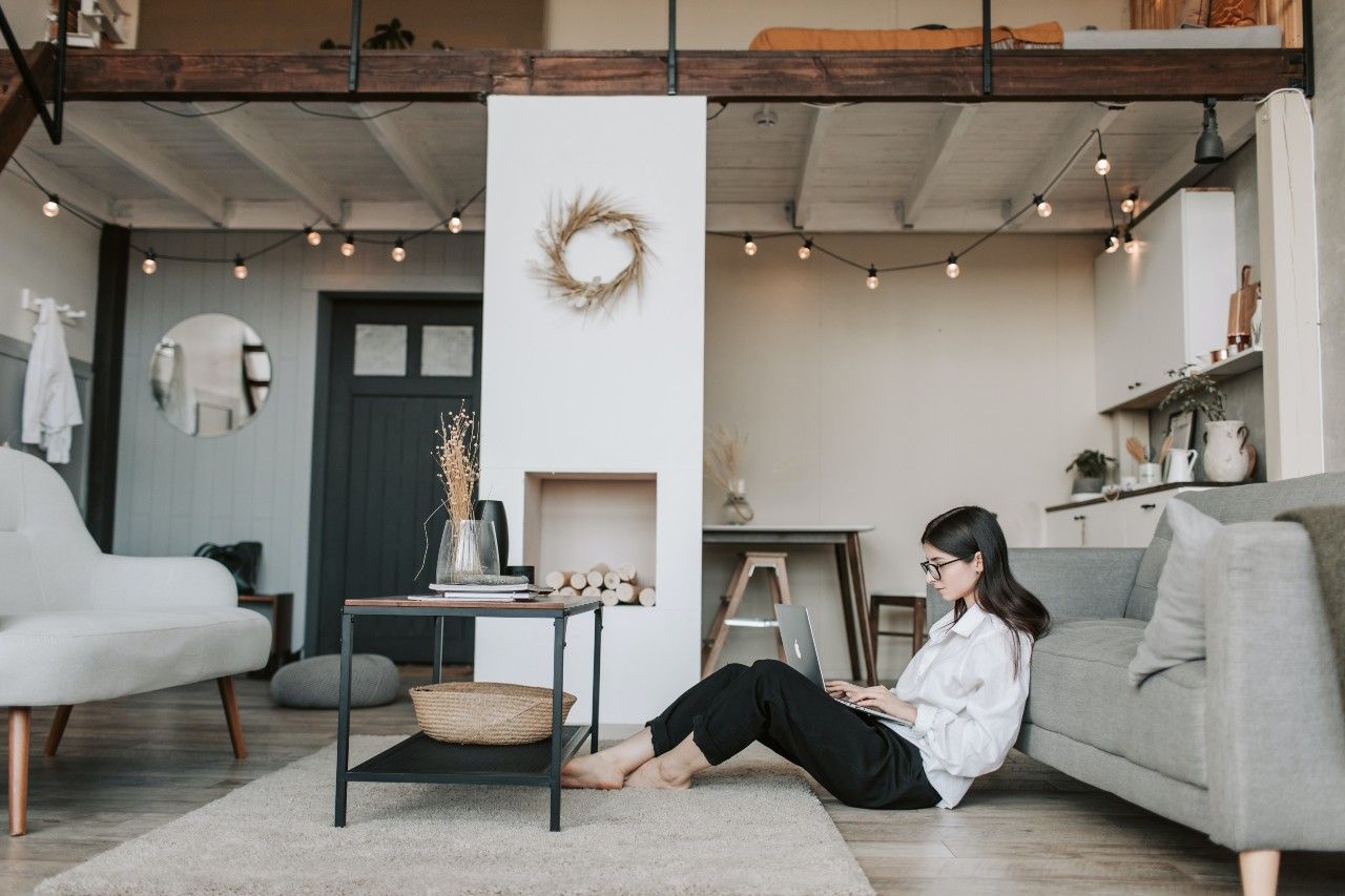 a woman working remotely in front of her laptop