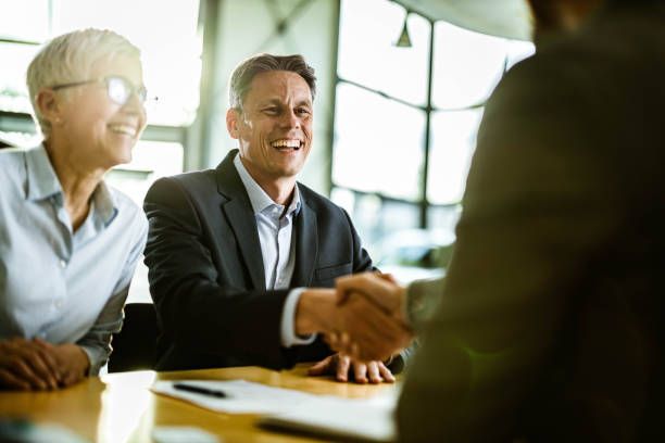 handshake after signing an agreement