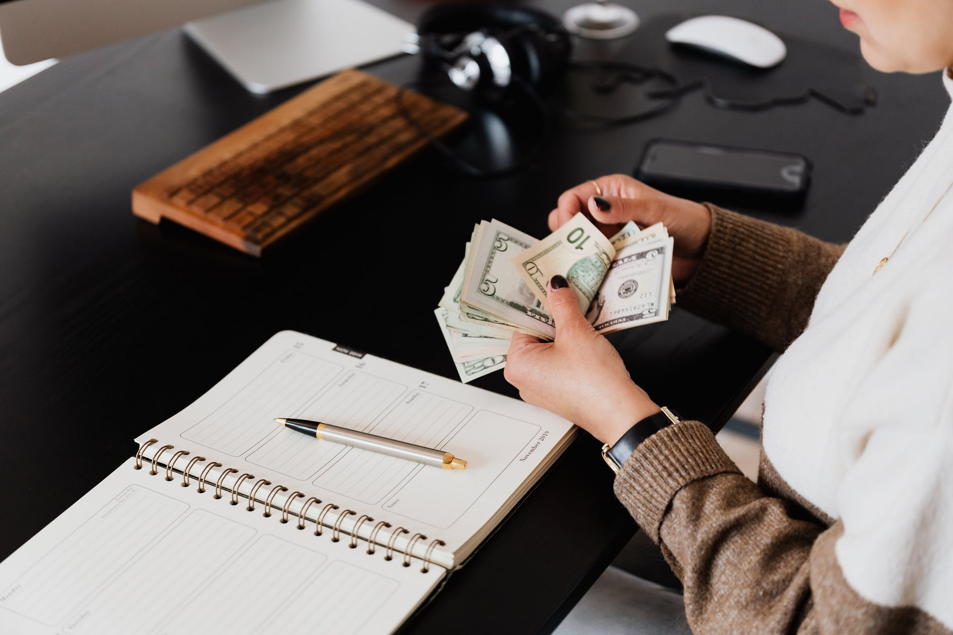 crop entrepreneur counting money in the office