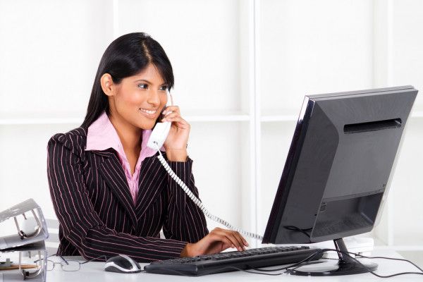 woman answering calls that shows how B2B appointment setting can help your business