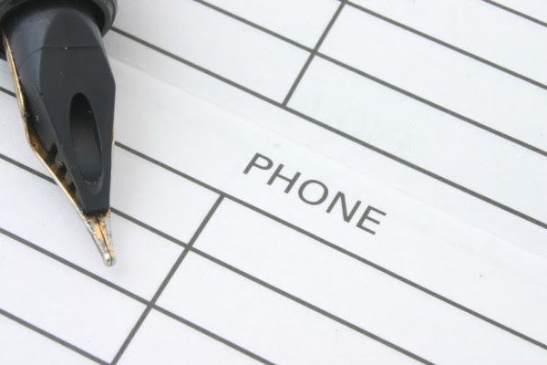 a pen and a paper with the word phone printed in it